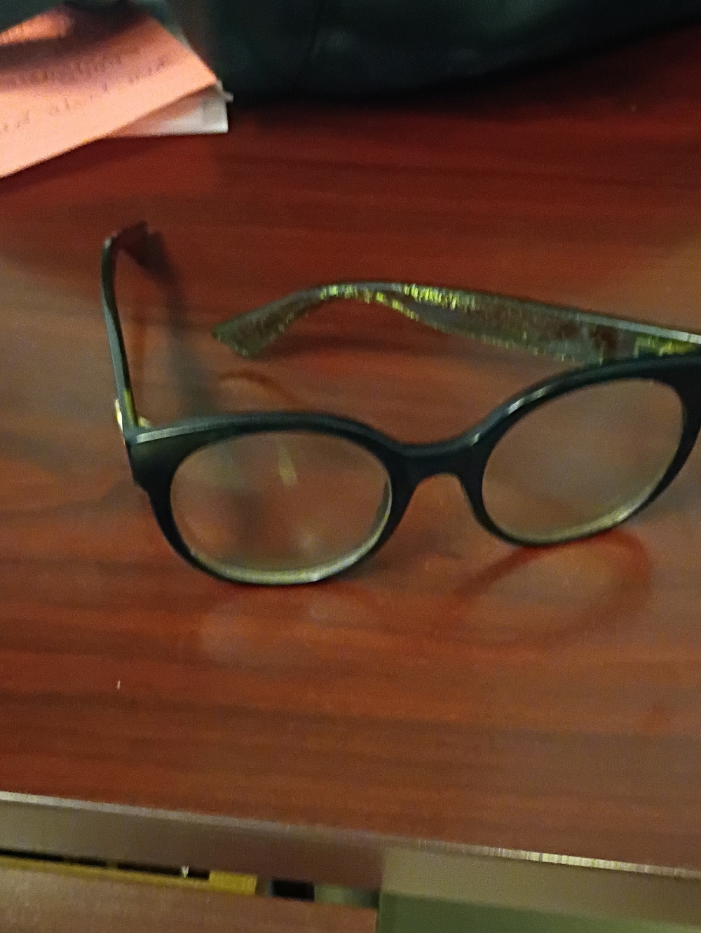 Gucci Black Round Women's Glasses with Subtle Gold Temples